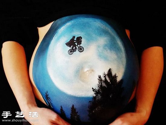 准妈妈隆起肚皮上的漂亮彩绘 -  www.shouyihuo.com