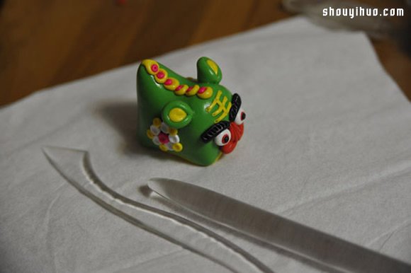 粘土制作可爱的单头布老虎儿童玩具图解教程 -  www.shouyihuo.com