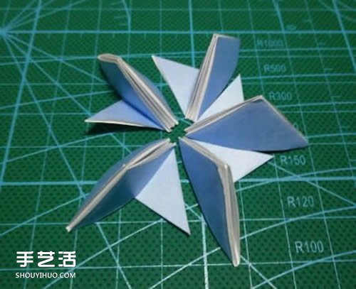 杨桃花怎么折图解教程 手工杨桃花折纸方法 -  www.shouyihuo.com