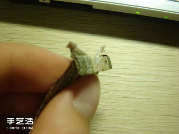 纸币折纸照相机图解 美金折相机的折法详解 -  www.shouyihuo.com
