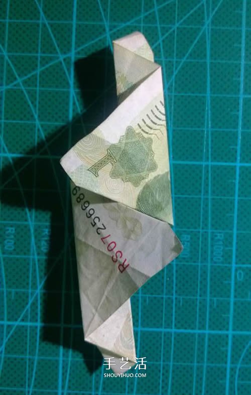 六角徽章的折法图解 一元纸币折纸六角徽章 -  www.shouyihuo.com