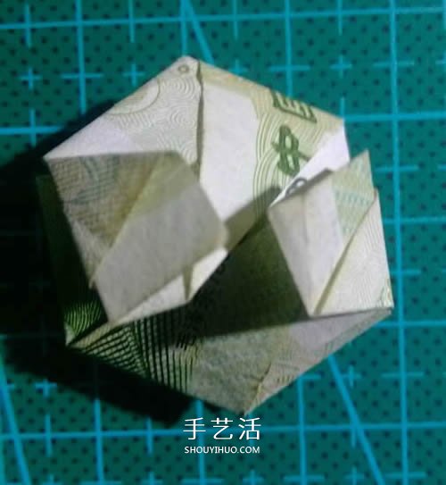 六角徽章的折法图解 一元纸币折纸六角徽章 -  www.shouyihuo.com