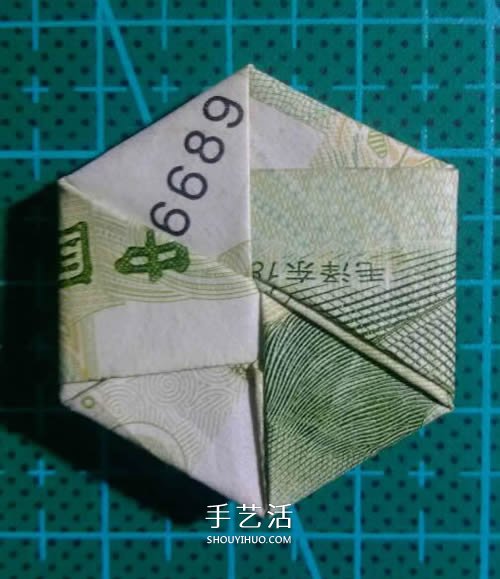 六角徽章的折法图解 一元纸币折纸六角徽章 -  www.shouyihuo.com
