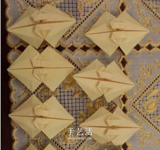漂亮立体雨伞折纸图解 纸雨伞的折法步骤图 -  www.shouyihuo.com