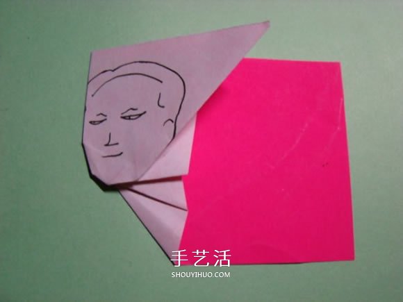 怎么折纸人物头像图解 戴帽子的人折法过程 -  www.shouyihuo.com