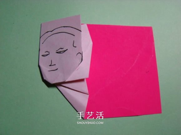 怎么折纸人物头像图解 戴帽子的人折法过程 -  www.shouyihuo.com