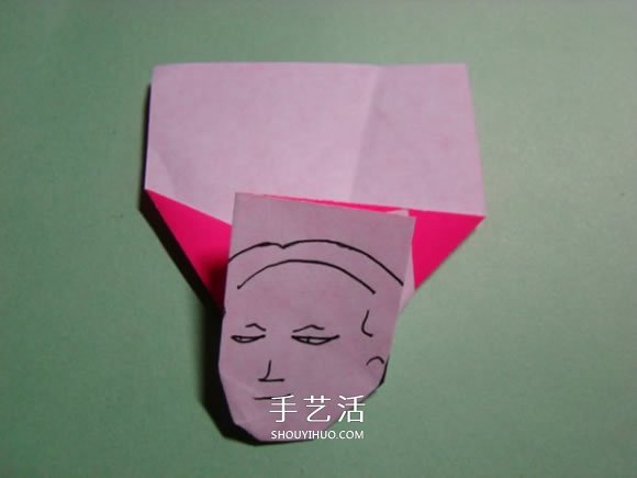 怎么折纸人物头像图解 戴帽子的人折法过程 -  www.shouyihuo.com