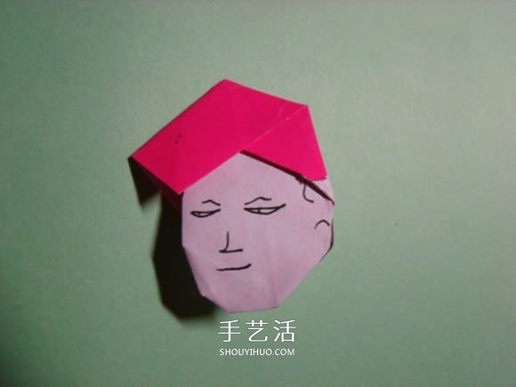 怎么折纸人物头像图解 戴帽子的人折法过程 -  www.shouyihuo.com