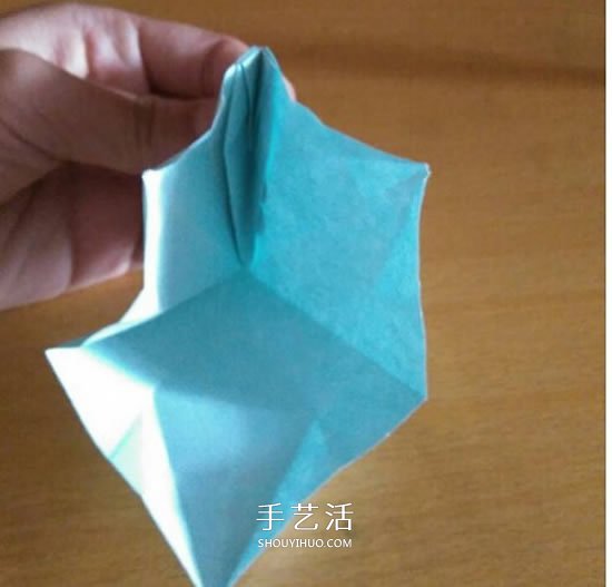 怎么折漂亮纸花 手工折纸八角星花的折法图解 -  www.shouyihuo.com