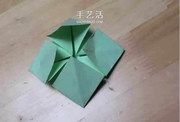 旋转纸陀螺怎么折图解 简单花型陀螺折纸教程 -  www.shouyihuo.com