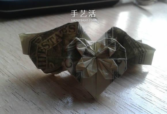 花心天使心的折法图解 好看美元折纸爱心教程 -  www.shouyihuo.com