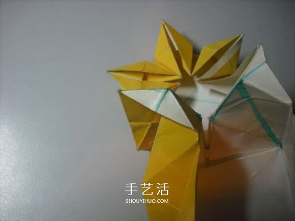 纸币勋章怎么折图解 手工折纸勋章的方法 -  www.shouyihuo.com