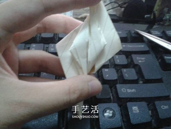 珠光海螺怎么折的教程 手工折纸海螺的步骤图 -  www.shouyihuo.com