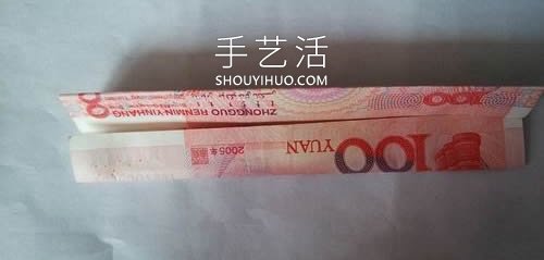 一百元面值人民币折玫瑰花的步骤图解 -  www.shouyihuo.com