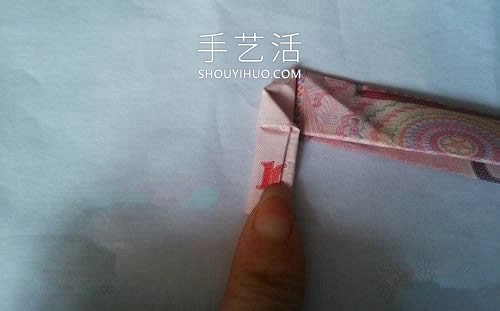 一百元面值人民币折玫瑰花的步骤图解 -  www.shouyihuo.com